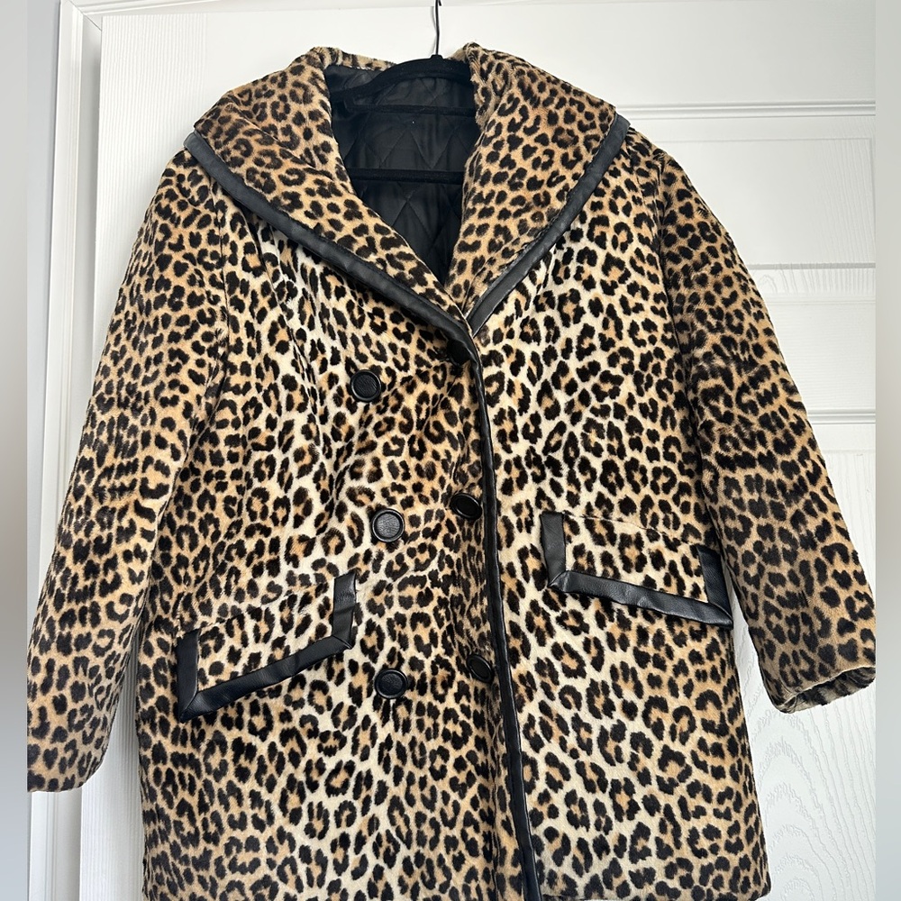 Vintage leopard coat with leather trim detail.